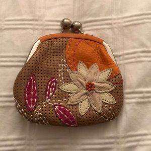 Fossil tan perforated leather coin pouch